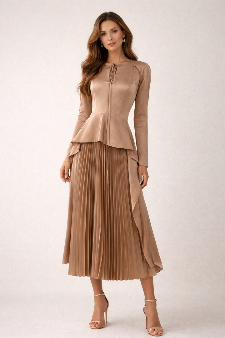 long sleeve satin peplum dress with pleated skirt and draped side panels – CARAMEL