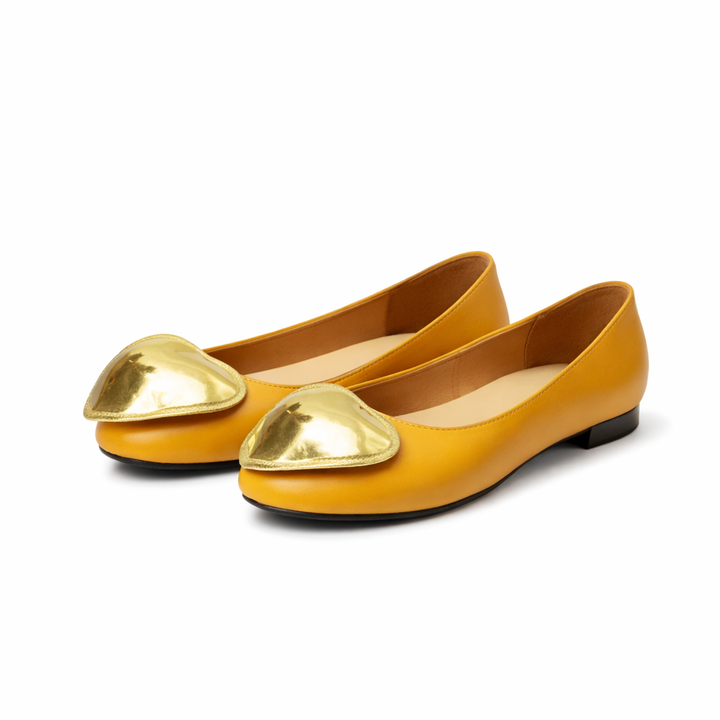 round-toe flats with oversized metallic accent – ADHAM
