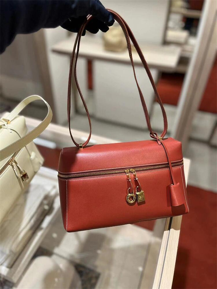 structured leather crossbody with gold lock detail – VERA