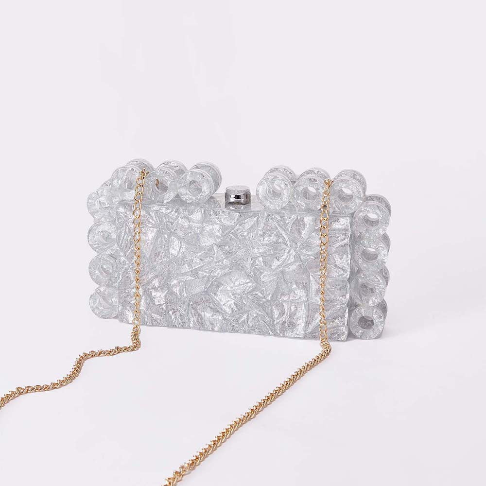 textured gold clutch with circular edge detailing – AURELIA