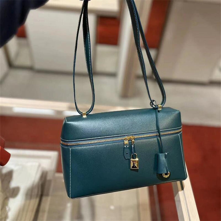 structured leather crossbody with gold lock detail – VERA