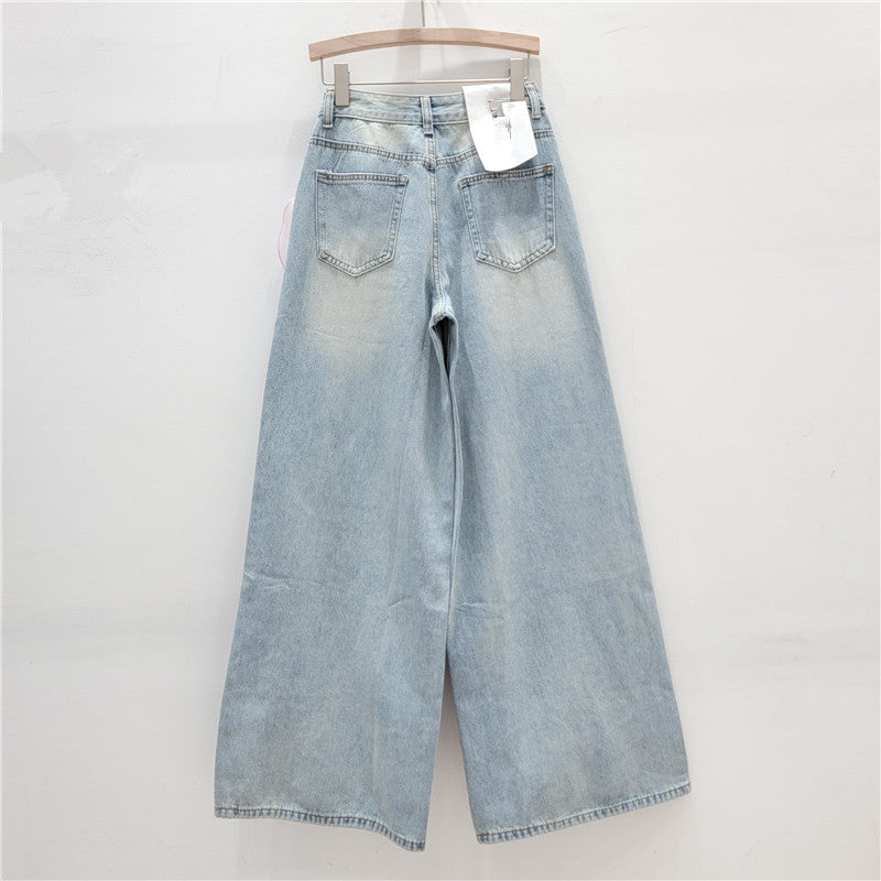 wide-leg denim pants with oversized organza floral appliqué – BLOSSOM
