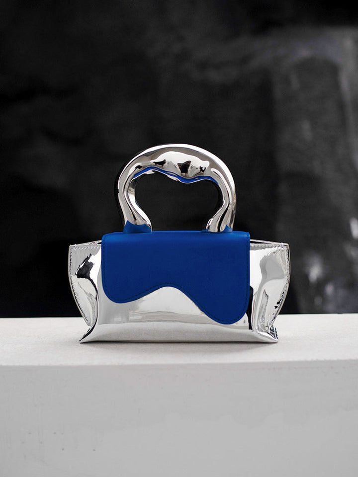 metallic-handle mini clutch with wavy flap - Xiuhtonal