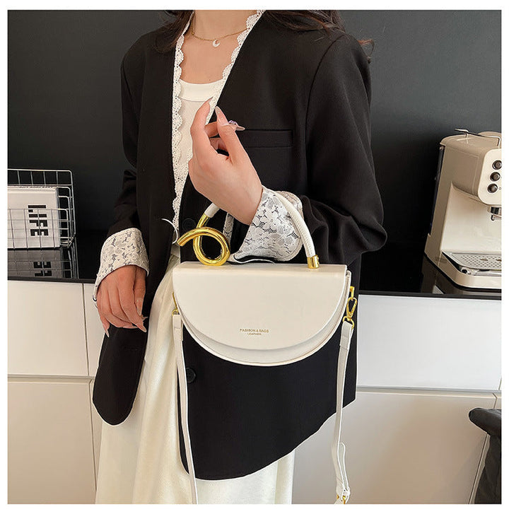 half-moon leather handbag with gold spiral handle – ORENA