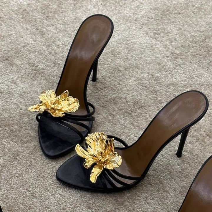 black stiletto mules with gold sculpted flower – CALISTA