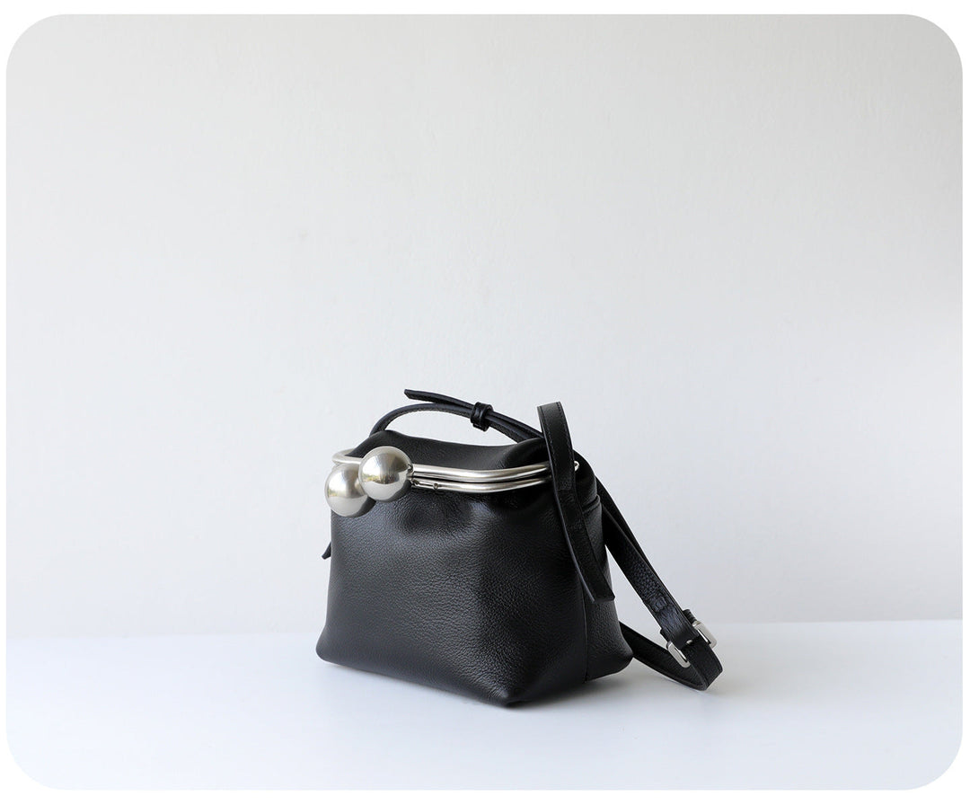 mini leather crossbody bag with metal frame clasp – YOUSF