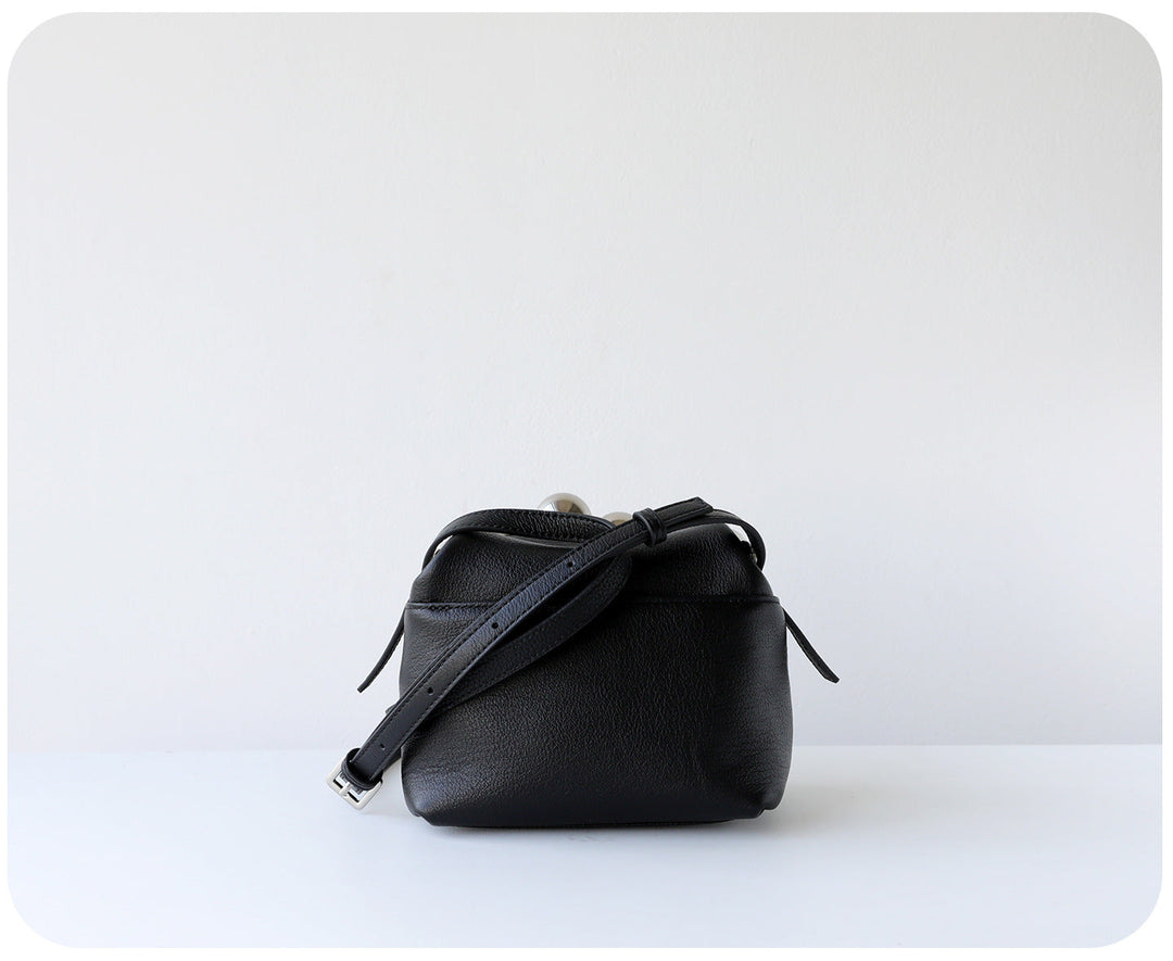 mini leather crossbody bag with metal frame clasp – YOUSF
