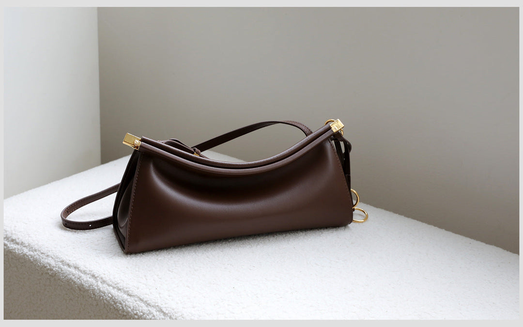 sleek leather shoulder bag with curved silhouette – ZOKSH