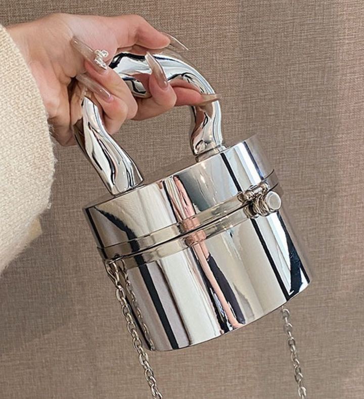 metallic dome clutch bag with sculptural handle – NOVQA