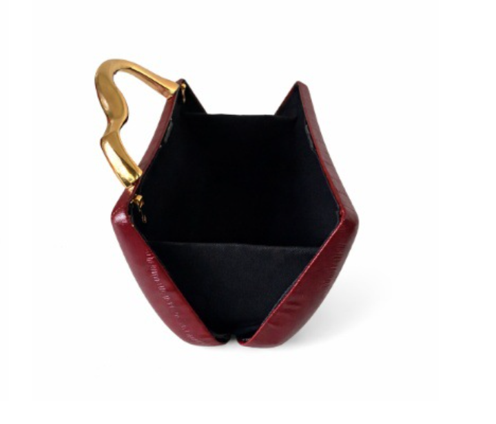structured leather-effect clutch with sculpted gold handle – VELORA